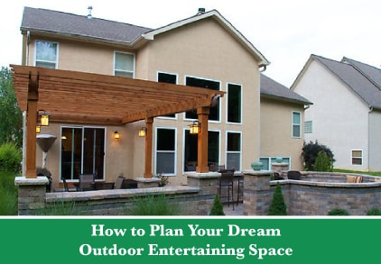 The back of a house with a patio surrounded by a low brick wall and half of the patio covered under a wooden pergola, with a green bar below and text reading "How to Plan Your Dream Outdoor Entertaining Space"