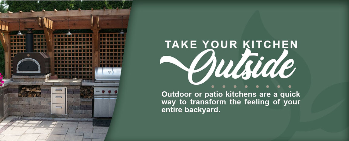 Picture of an outdoor grill and fireplace to the left with a green background with a faint leaf design on the right that has text, partly written with script to emphasize the word "outside", fully reading as "Take your kitchen outside. Outdoor or patio kitchens are a quick way to transform the feeling of your entire backyard.