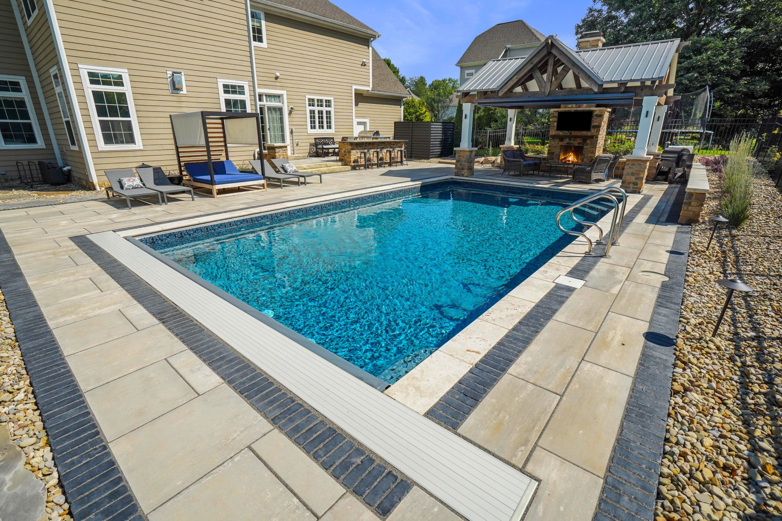 inground pool and paver patio
